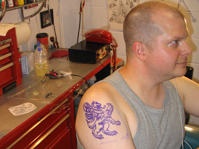 The stencil, with equipment in the background.